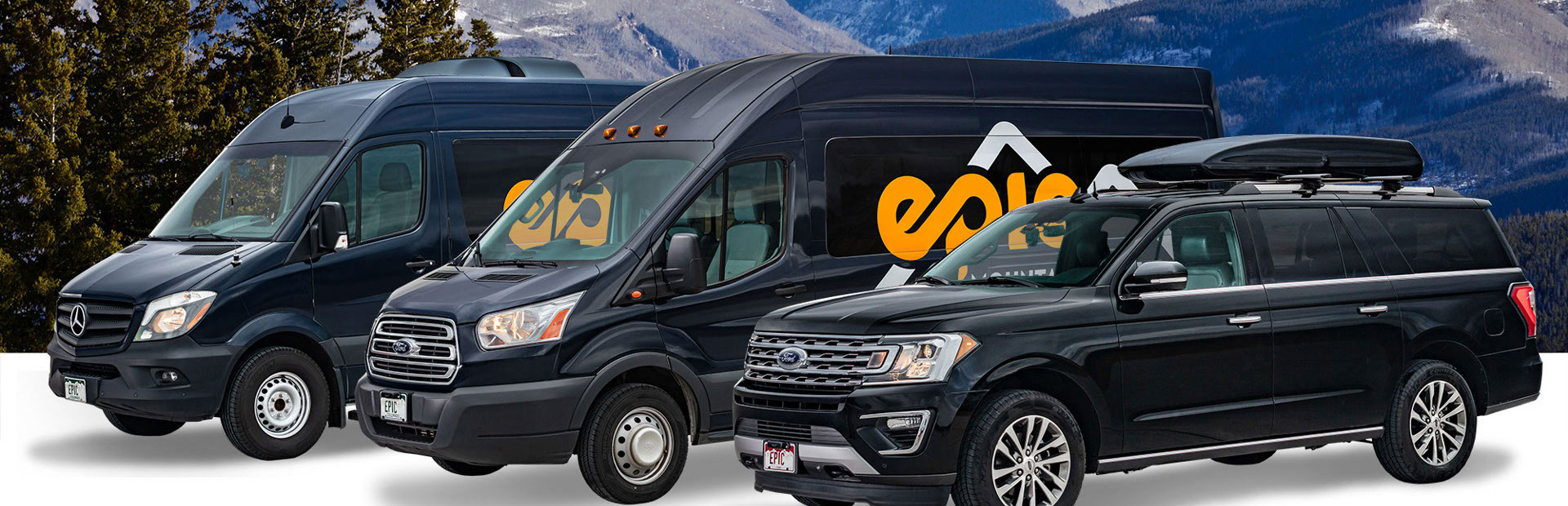 Three black Epic Mountain Express vehicles with a mountain backdrop behind